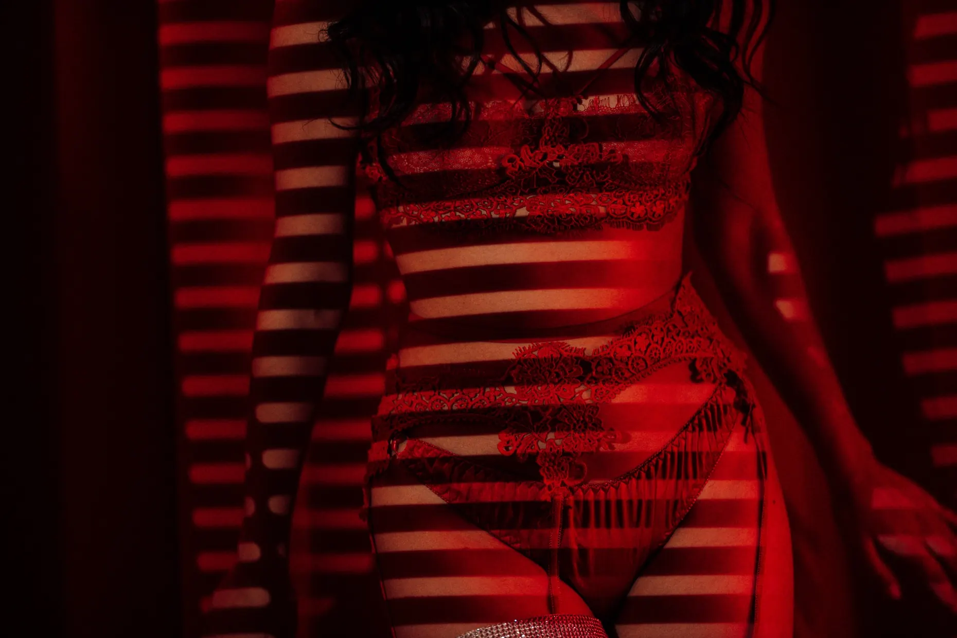 Crimson neon-lit portrait photograph